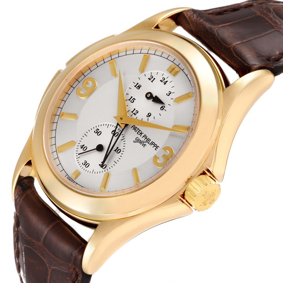 Patek Philippe Travel Time Mens watch Unisex Manual winding Yellow gold 5134J 5